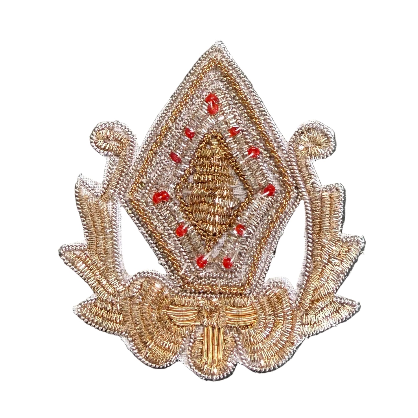 A decorative embroidered patch featuring a diamond-shaped central motif with red bead accents and ornate side scroll details.