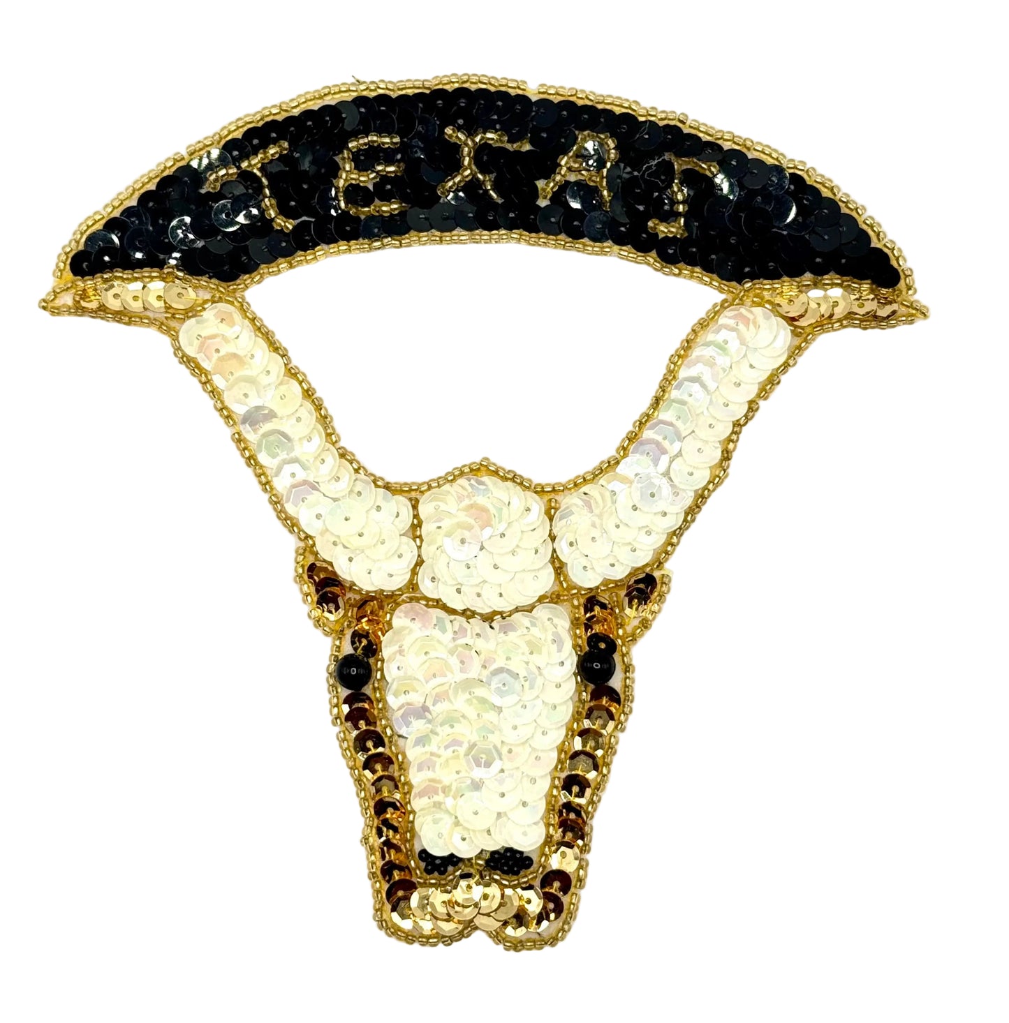 An appliqué of a longhorn steer with a Texas banner, made with off-white, black, and gold sequins, and gold beads.