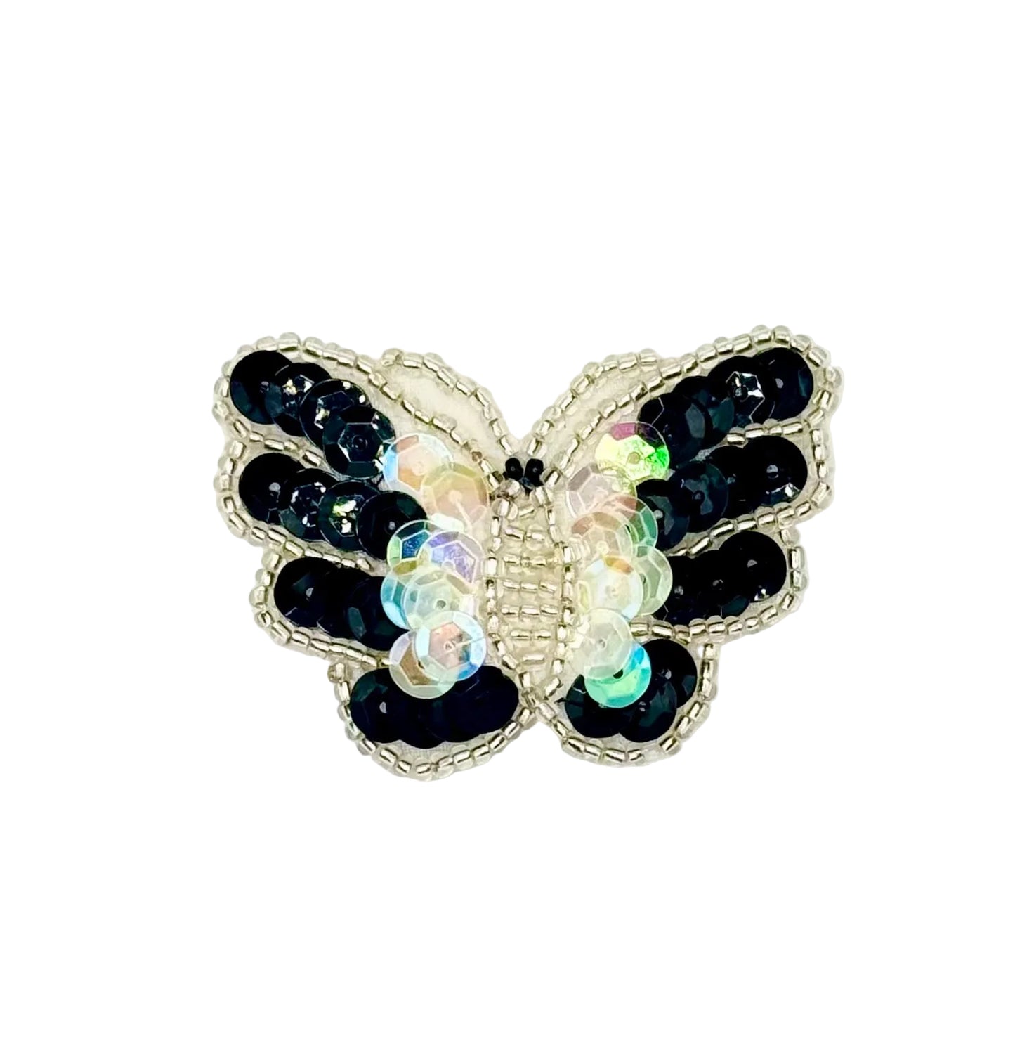 Butterfly-shaped sequin patch with black and iridescent wings on a white background