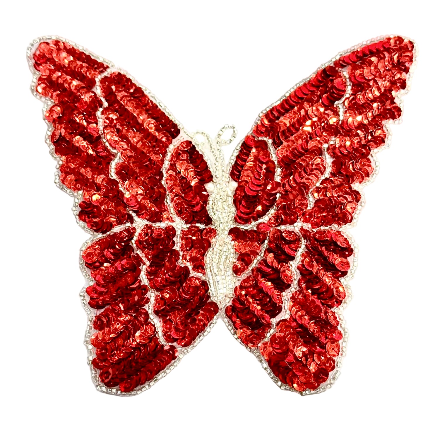 Red sequin butterfly patch on a white background