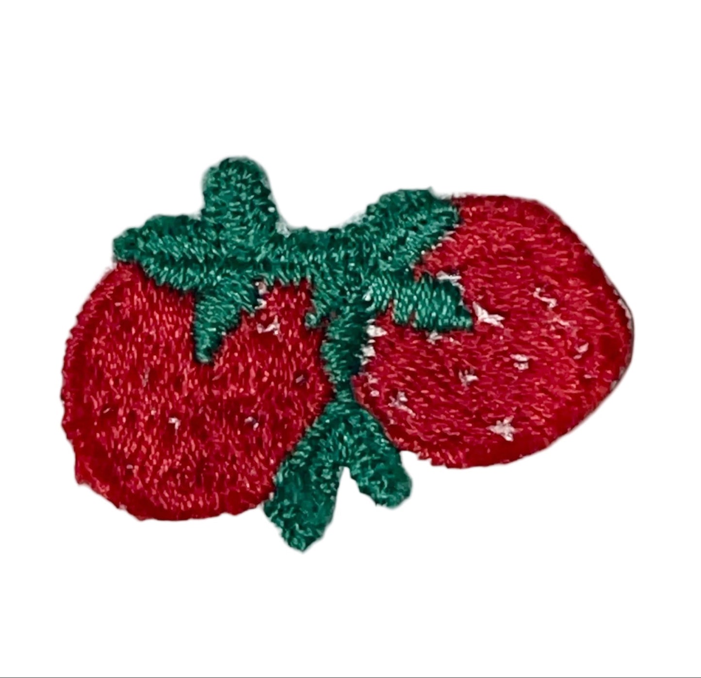 An embroidered patch depicting two red strawberries with green stems and leaves, shown on a plain white background.