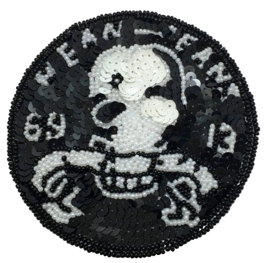 Sequined patch with a skeleton design on a white background