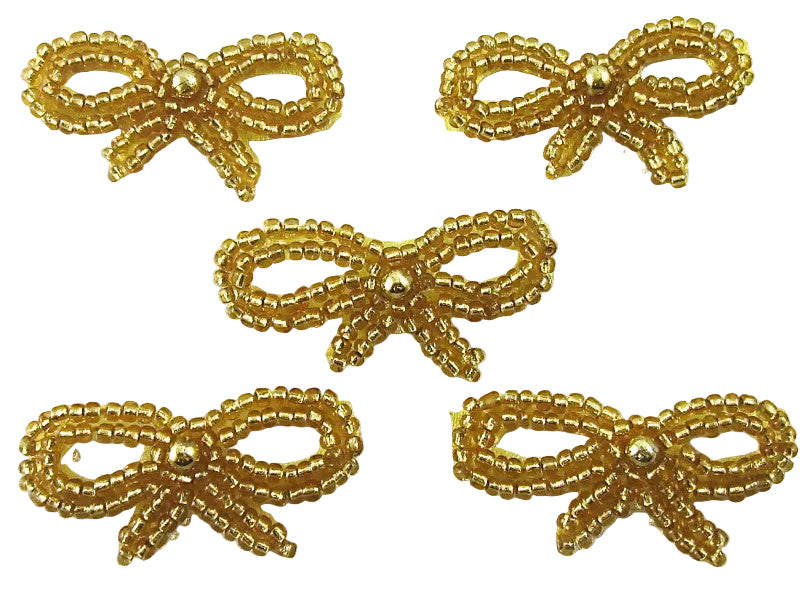 Five gold beaded bows on a white background