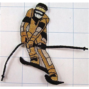 Downhill Skier, Black with Gold and Silver Metallic Iron-on 3" x 3.5"