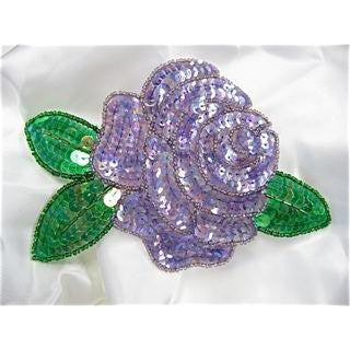 Flor con lentejuelas y cuentas moradas claras y verdes de 6.5" x 4"