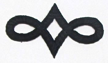 Designer Motif, Black Embroidered Iron-On 2.75" x 1.5"