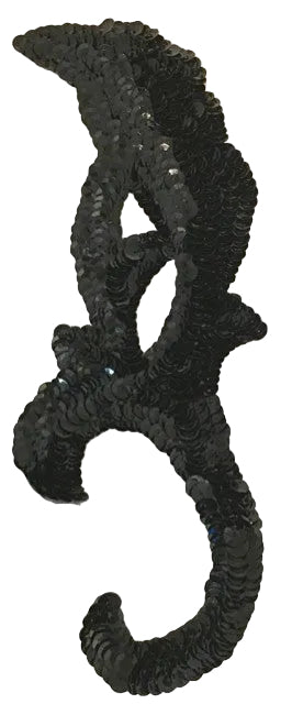 Black sequin applique on a white background