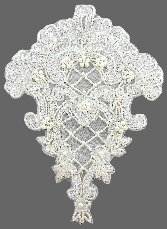 Decorative sequin and bead patch with intricate patterns and pearl-like embellishments on a gray background