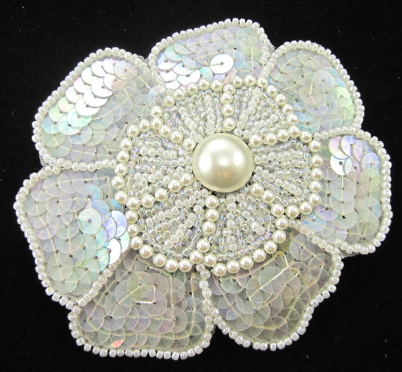 Flor con lentejuelas iridiscentes y perlas blancas de 10 x 10 cm