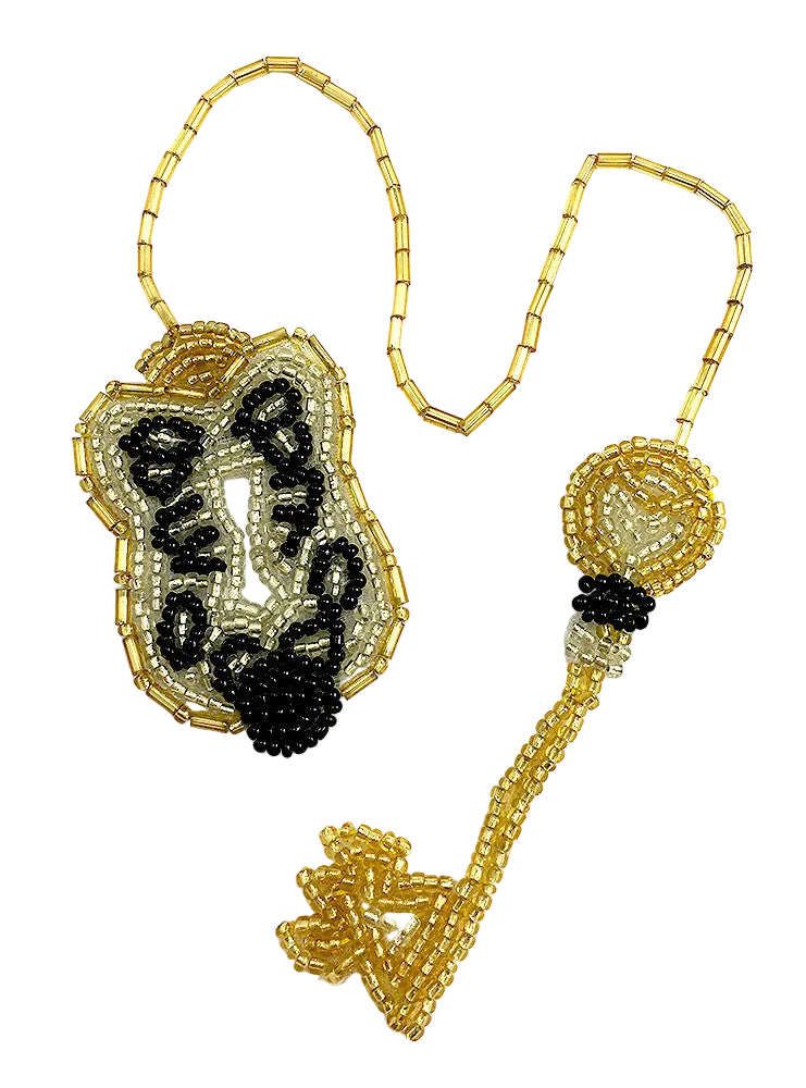 Beaded lock and key shaped ornament with black accents on a white background