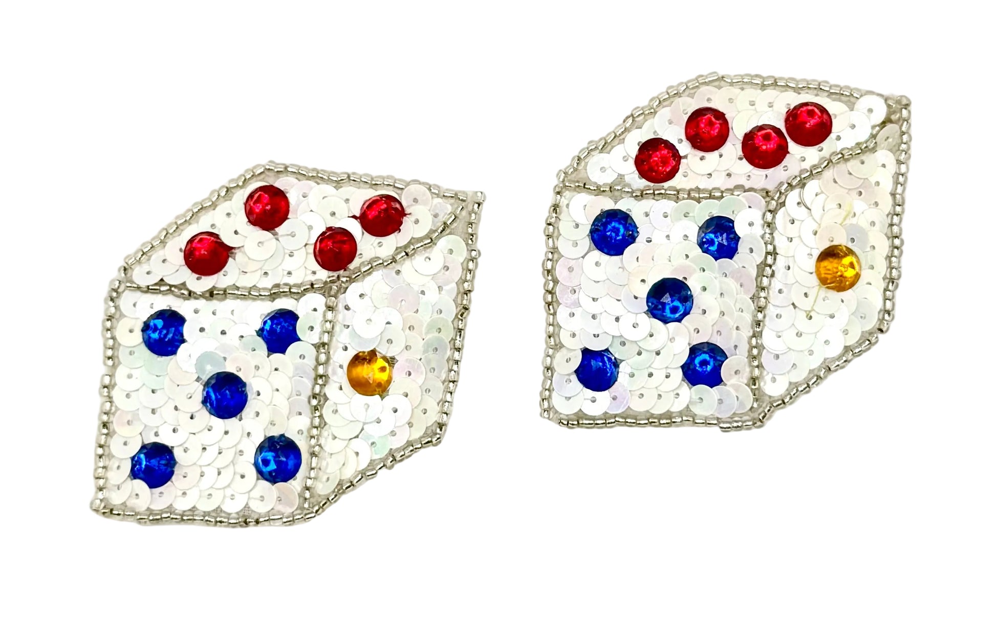 Pair of sequin dice-shaped patches with colorful gemstones on a white background