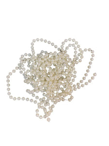 Loose pearls on a White String