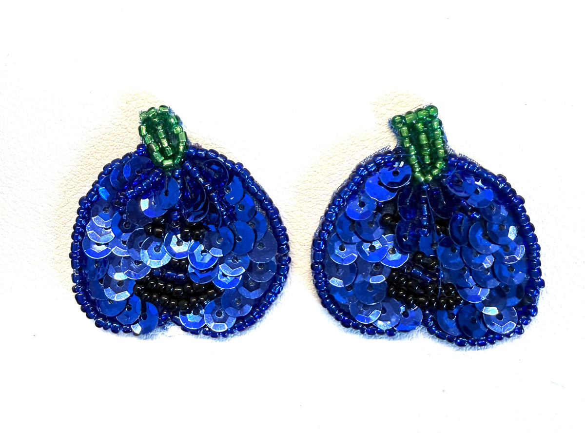 Sequin and bead pumpkin pair with Royal blue sequins, a green bead stem  and black bead eyes and mouth on a white background.