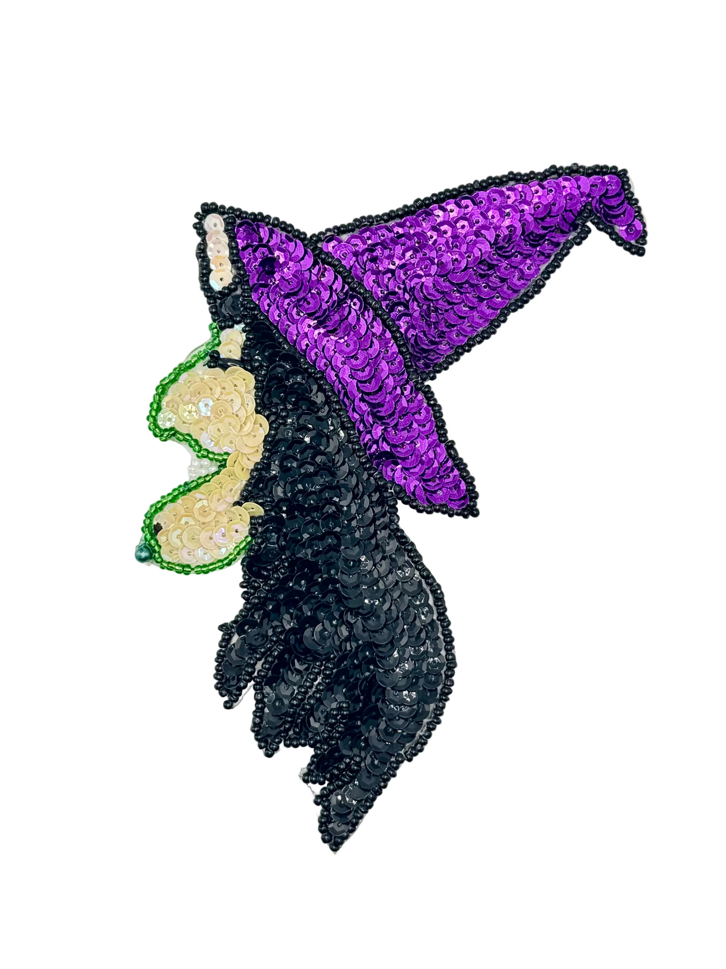Sequined witch with a purple top and black hair on a white background