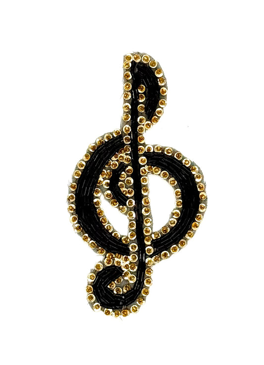 Clave de sol con lentejuelas doradas y cuentas negras y doradas 5" X 3"