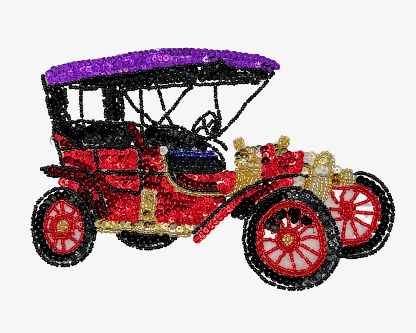 A vintage-style car embellished with sparkling sequins and beads, featuring a purple canopy, red body, gold details, and red-spoked wheels on a plain white background.