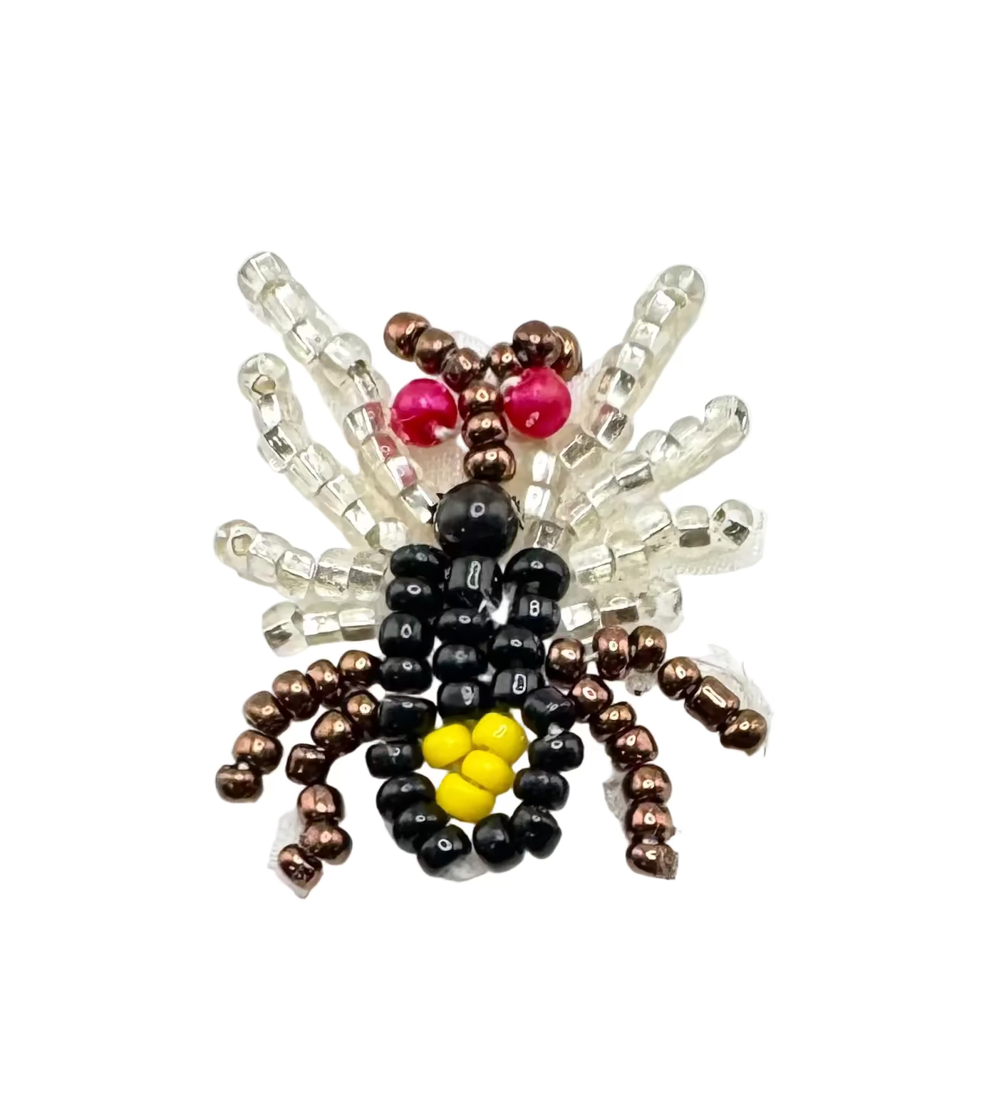 Spider-shaped object made of beads on a white background