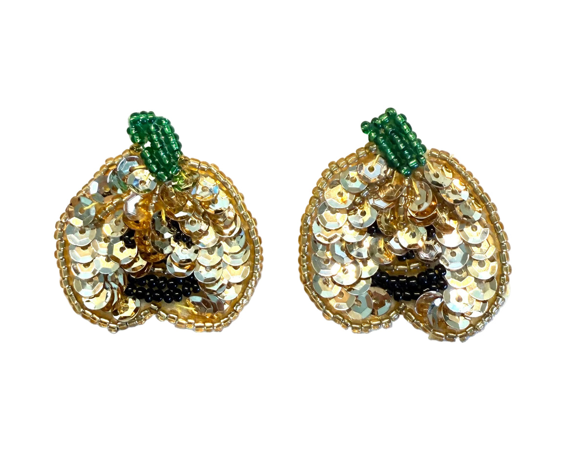 A pair of decorative sequined and beaded pumpkin  embellishments on a plain white background. Each pumpkin features a gold sequin body, a green beaded stem, and small black bead accents near the bottom.
