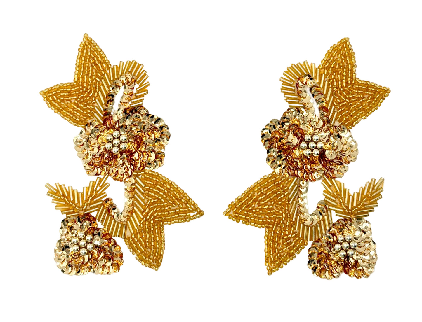 A pair of gold and sequin and bead patches shaped like flowers with leafy vines, displayed on a clean white background.
