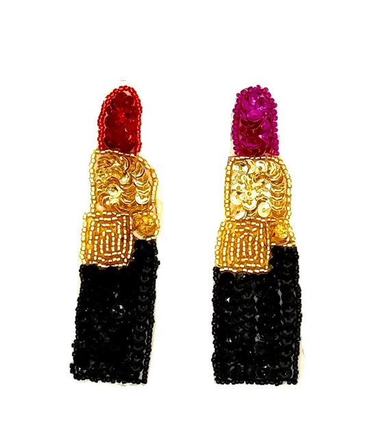 Sequin and bead lipstick with red or Fuchsia top, gold middle, and black bottom on a white background