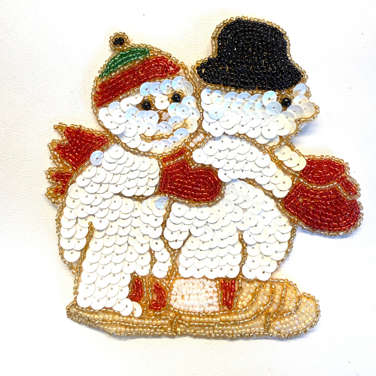 Pareja de muñecos de nieve en trineo 5" x 5"