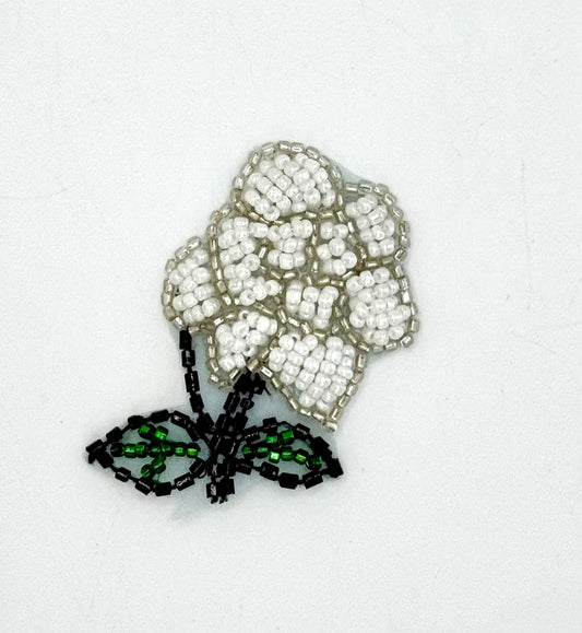 White Flower with silver, White, Black and Green Beads 2" x 1.75