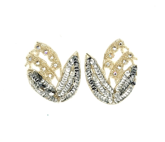 A pair of clear and silver leaf-shaped appliqués embellished with clear rhinestones, shown on a plain white background.