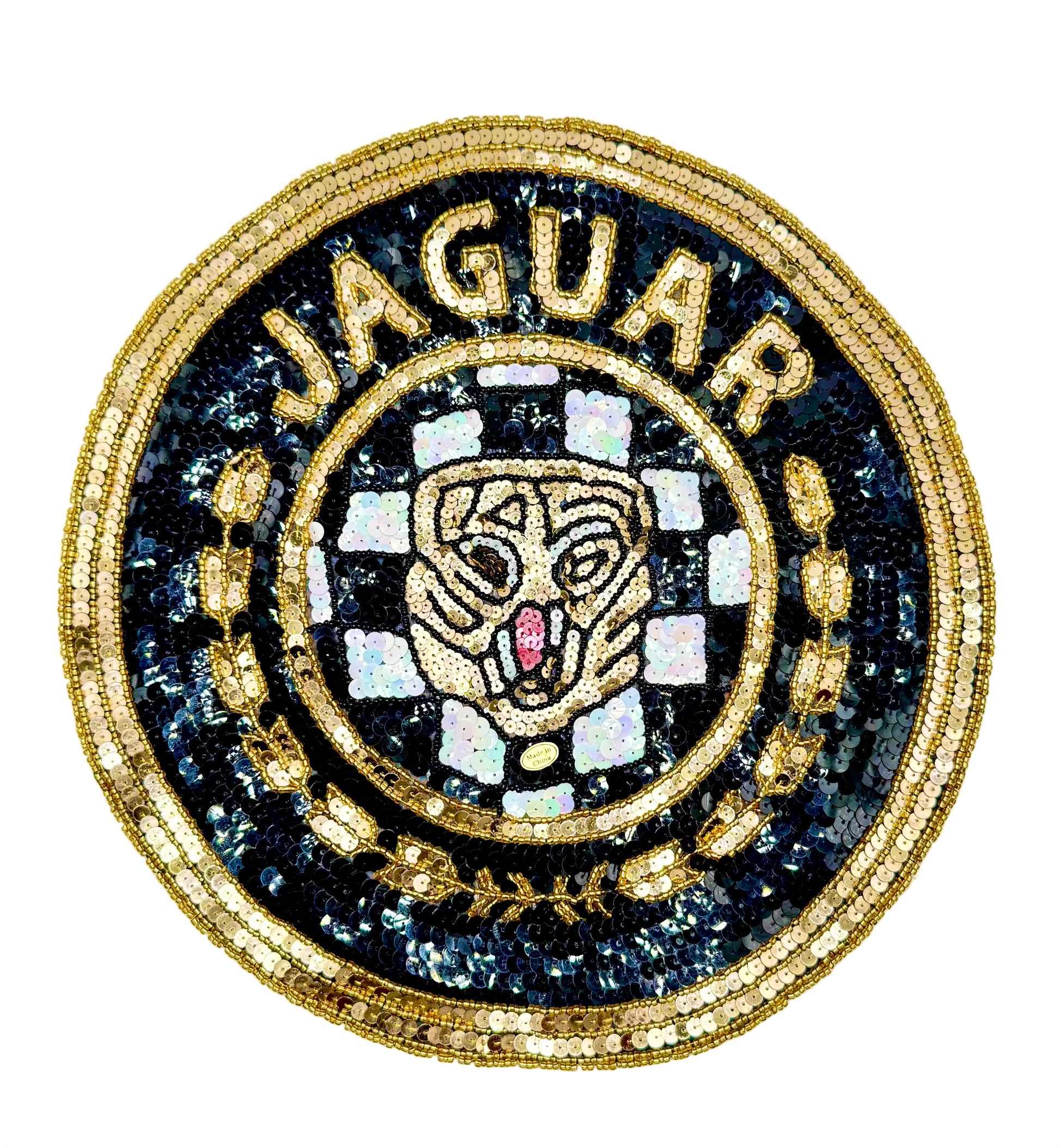 A circular sequin and bead vintage patch featuring the word 'JAGUAR' in gold around a stylized jaguar head on a black and white checkered background, with gold sequined detailing.