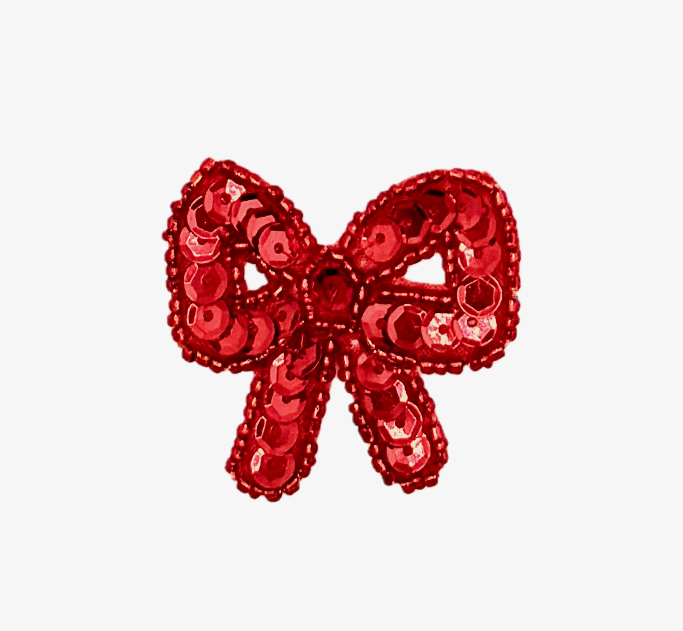 Red sequin bow on a white background