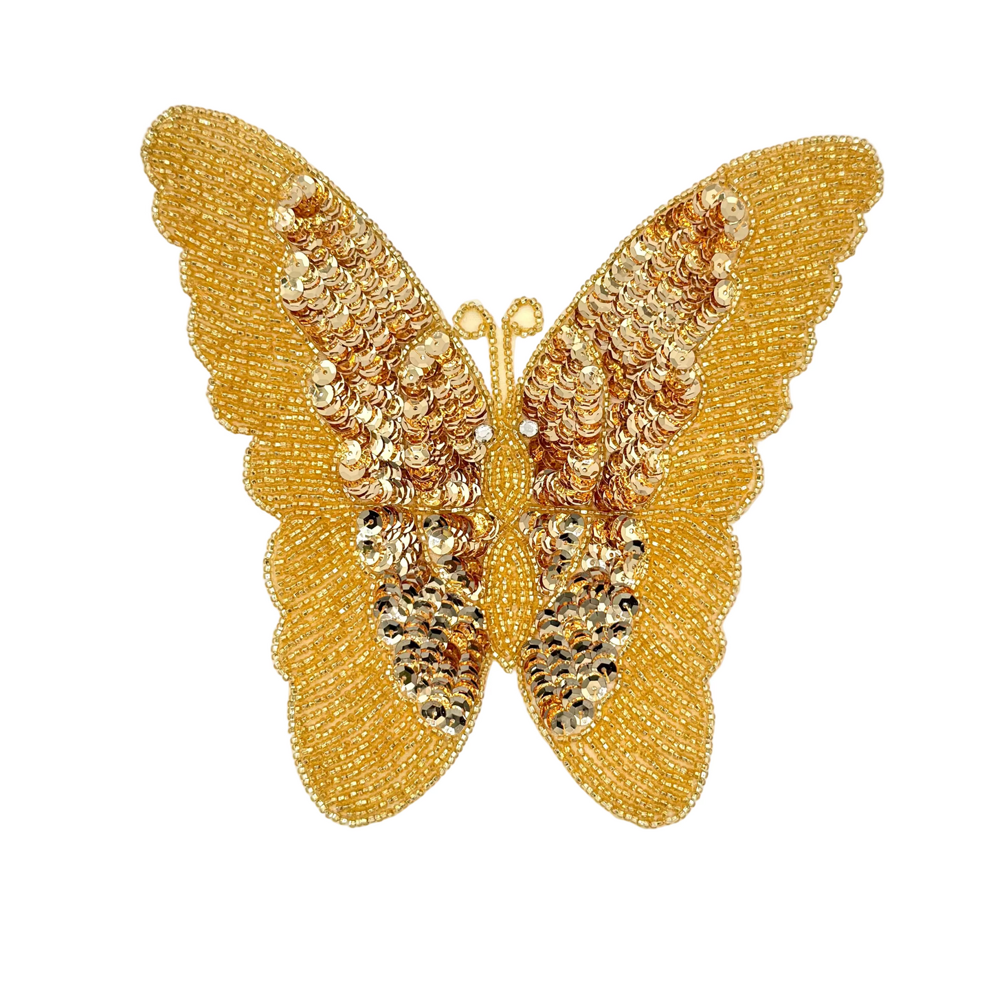 Gold butterfly decorative patch on a white background