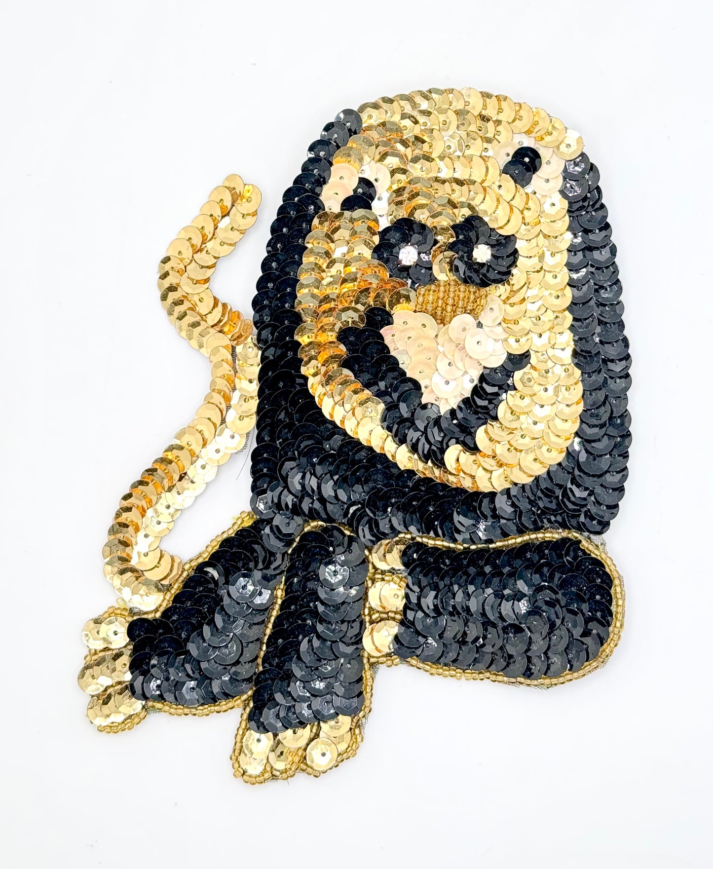 Lion with Black, Cream and Gold Sequins, Gold Beads and Rhinestone Eyes 5.5" x 4.75”