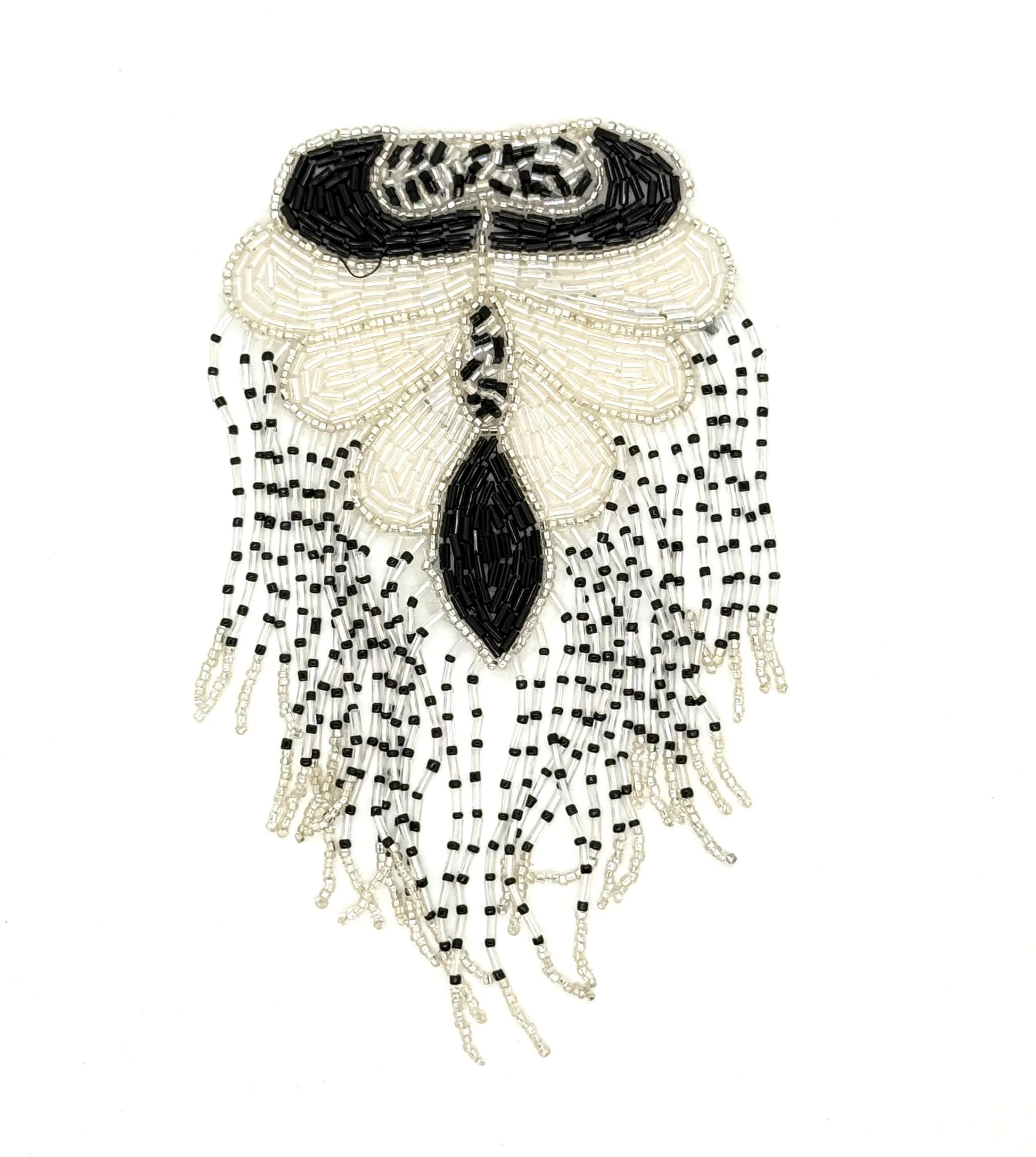 Decorative black and white beaded epaulet with fringe on a white background