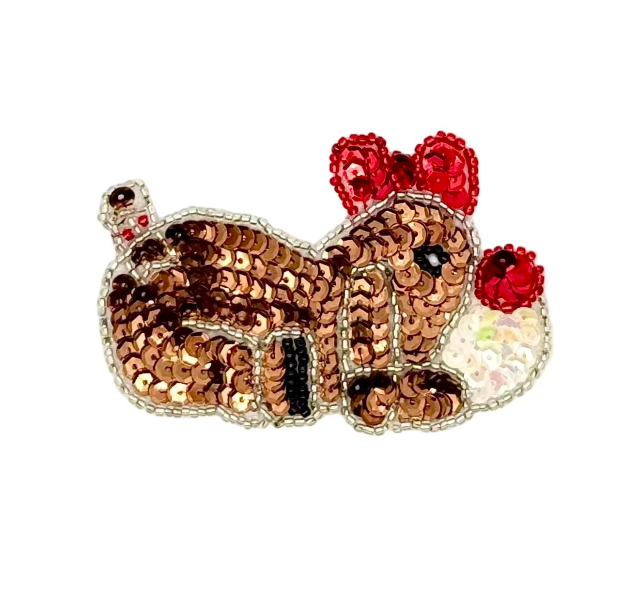 Sequined dog with red bow on a white background