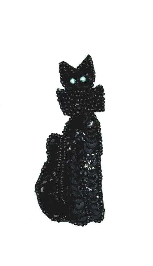 Black cat-shaped patch with sequins on a white background