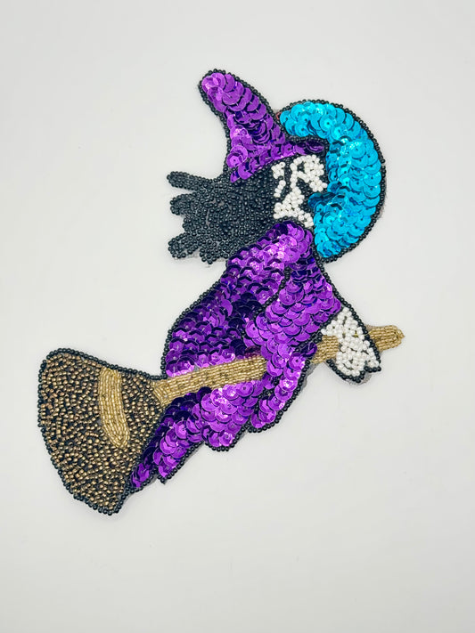 Witch on Broomstick with Turquoise and Purple Sequins with Black, White and Gold Beads 6" x 6"