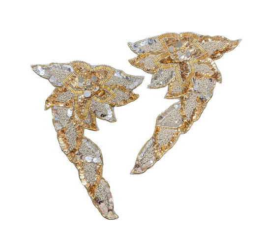 Flower Pair with gold and silver sequined appliqué patches shaped like stylized floral or wing-like motifs.