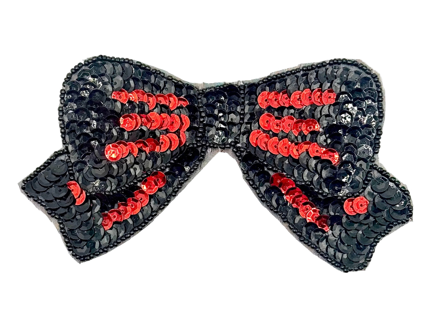 Black sequin bow with red centers on a white background