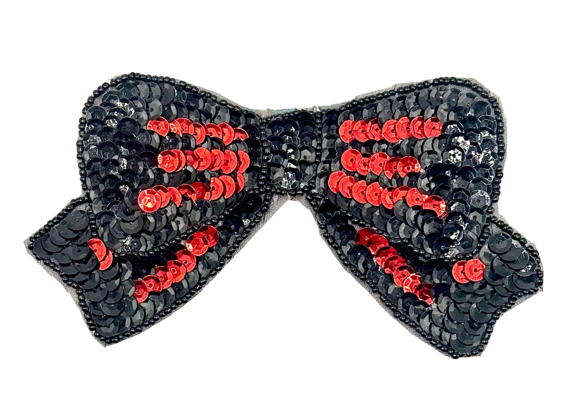 Black sequin bow with red centers on a white background