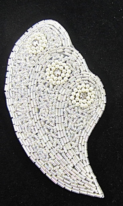 Decorative leaf-shaped beaded patch on a black background