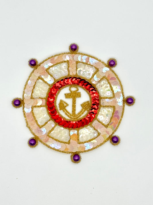 Ship’s Wheel with Gold Anchor, Red, Iridescent Clear and Cream Sequins and Purple Pearls 5.25"