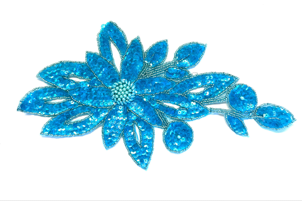 Flor con lentejuelas y cuentas turquesa 28 cm x 15 cm