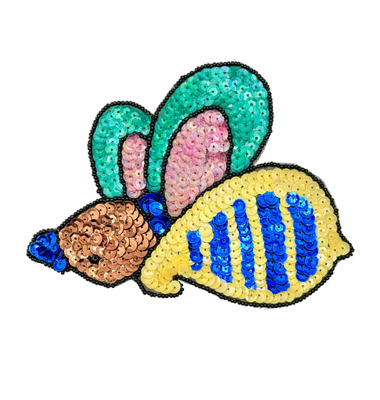 Colorful sequin patch of an insect on a white background