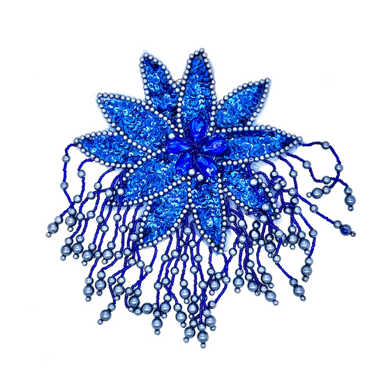 Blue decorative epaulet with bead embellishments on a white background
