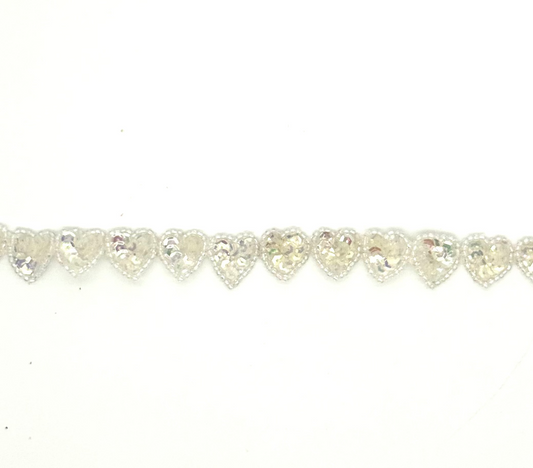 Heart-shaped sequin heart s by the yard on a white background