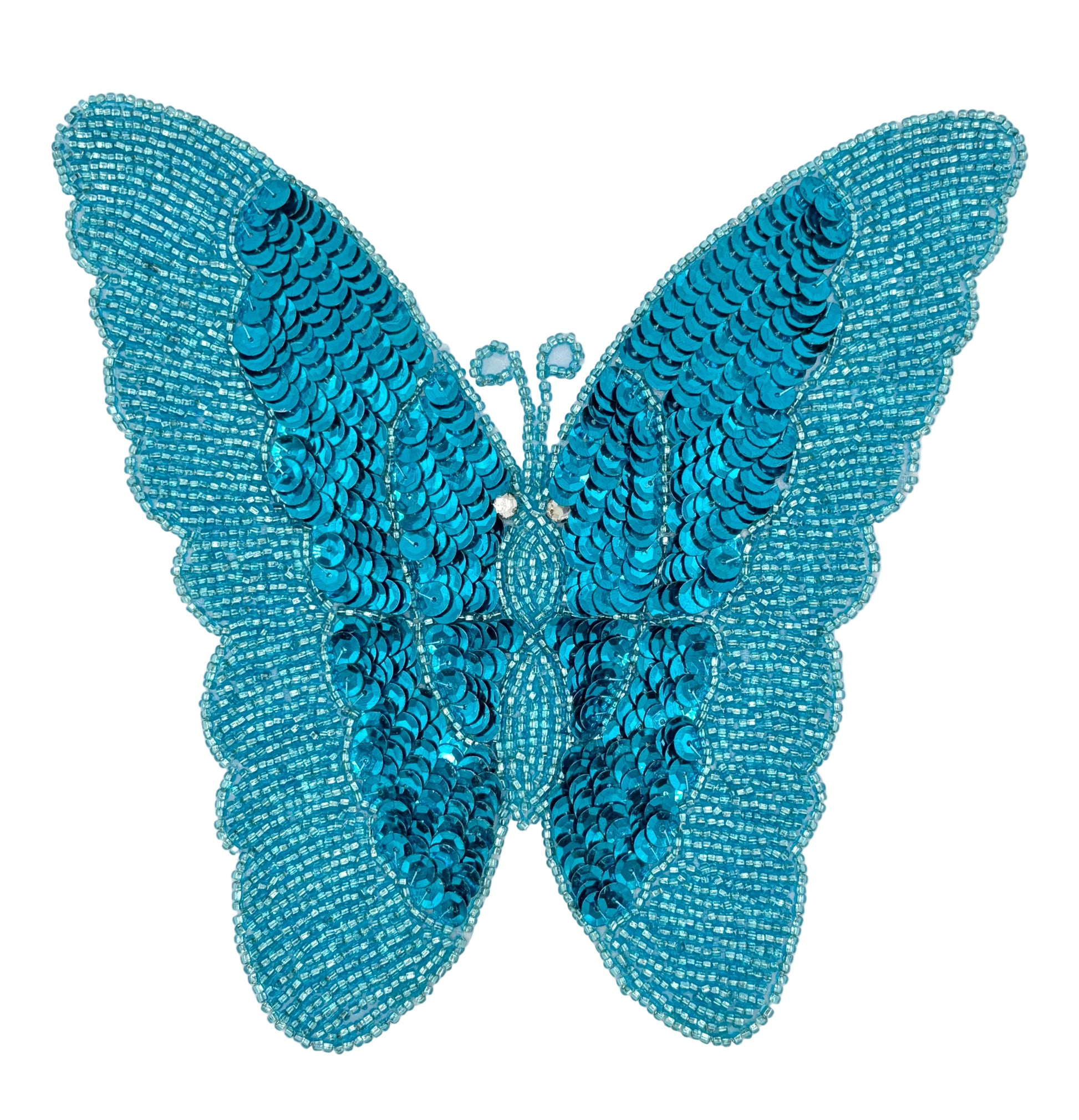 Turquoise butterfly-shaped decorative item with sequins on a white background