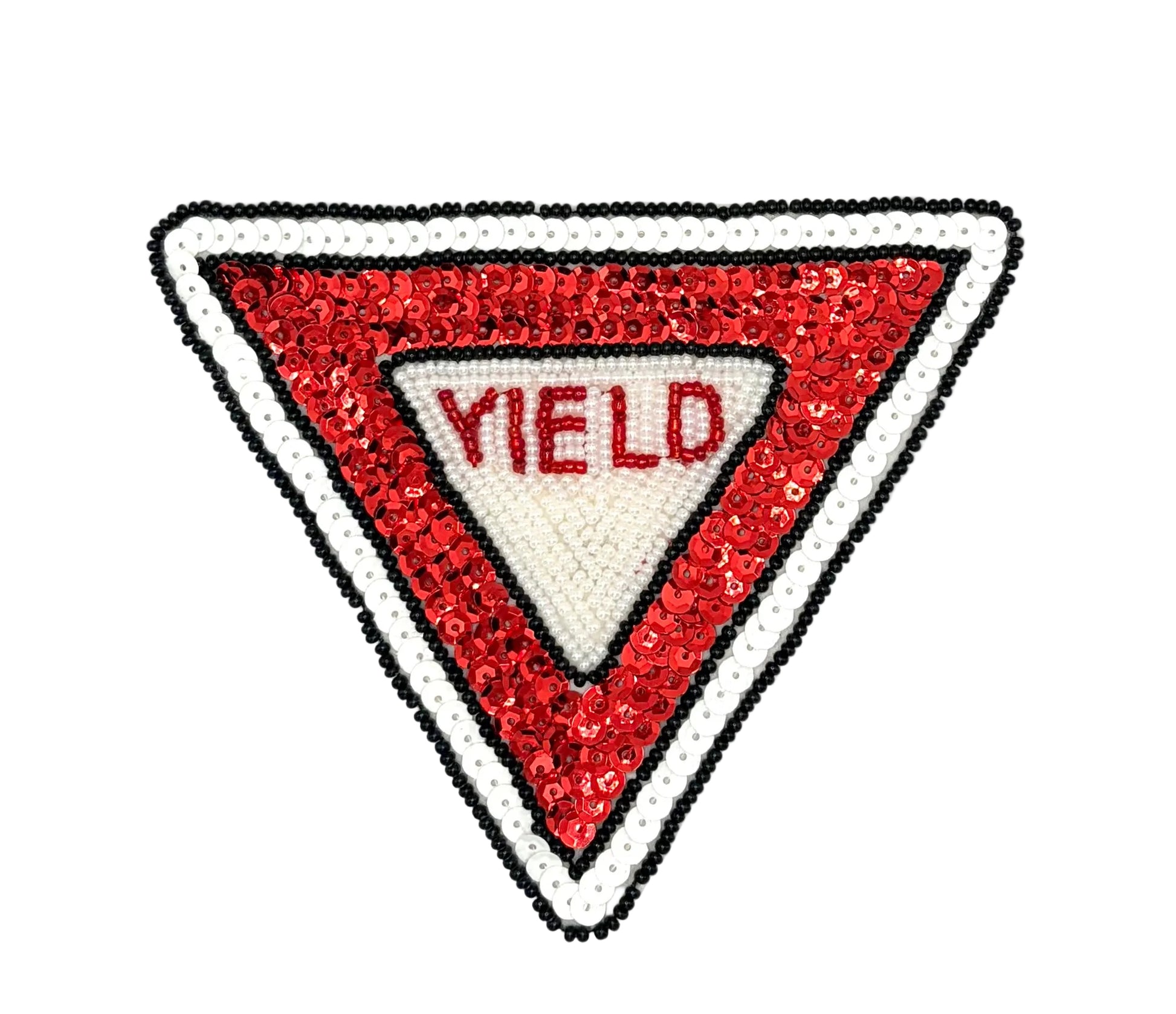 A triangular sequined patch designed like a road yield sign, featuring red sequins, a white center with the word 'YIELD' in red, and a white border outlined with black sequins, set against a plain white background.