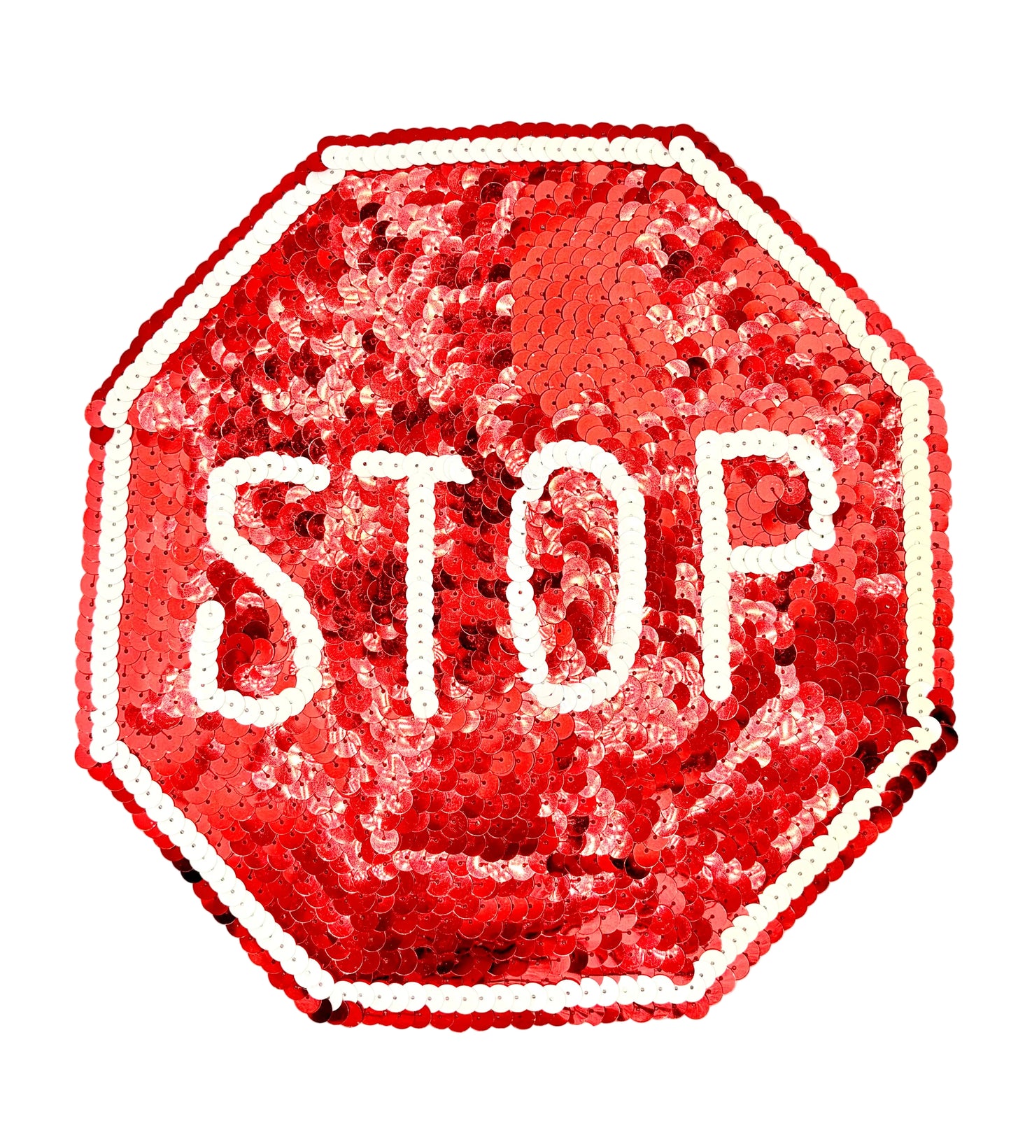 A stop sign made of red sequins with white sequined lettering and border, photographed on a plain white background.