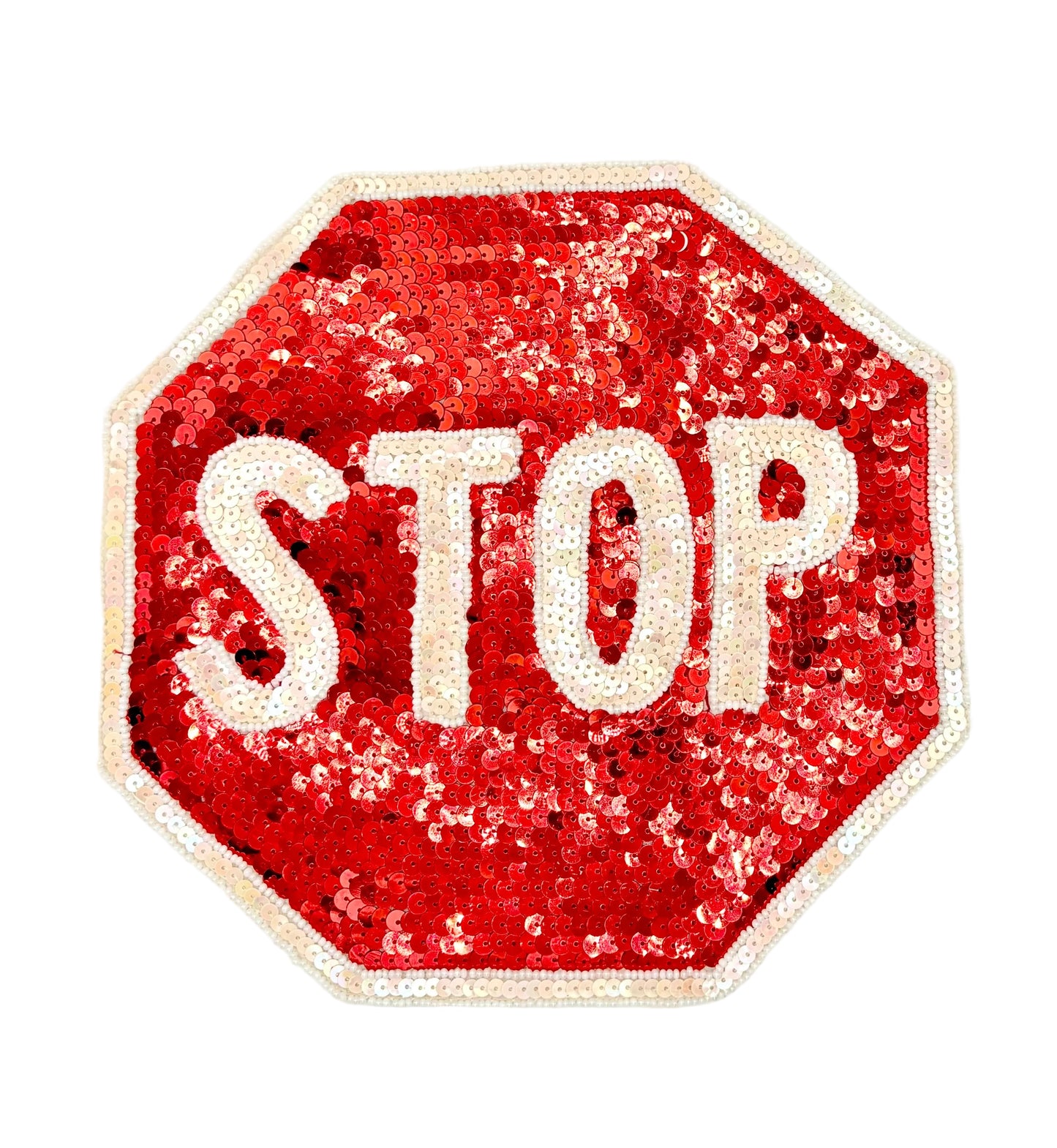 A sequined stop sign patch with red sequins and white sequined lettering on a white background.