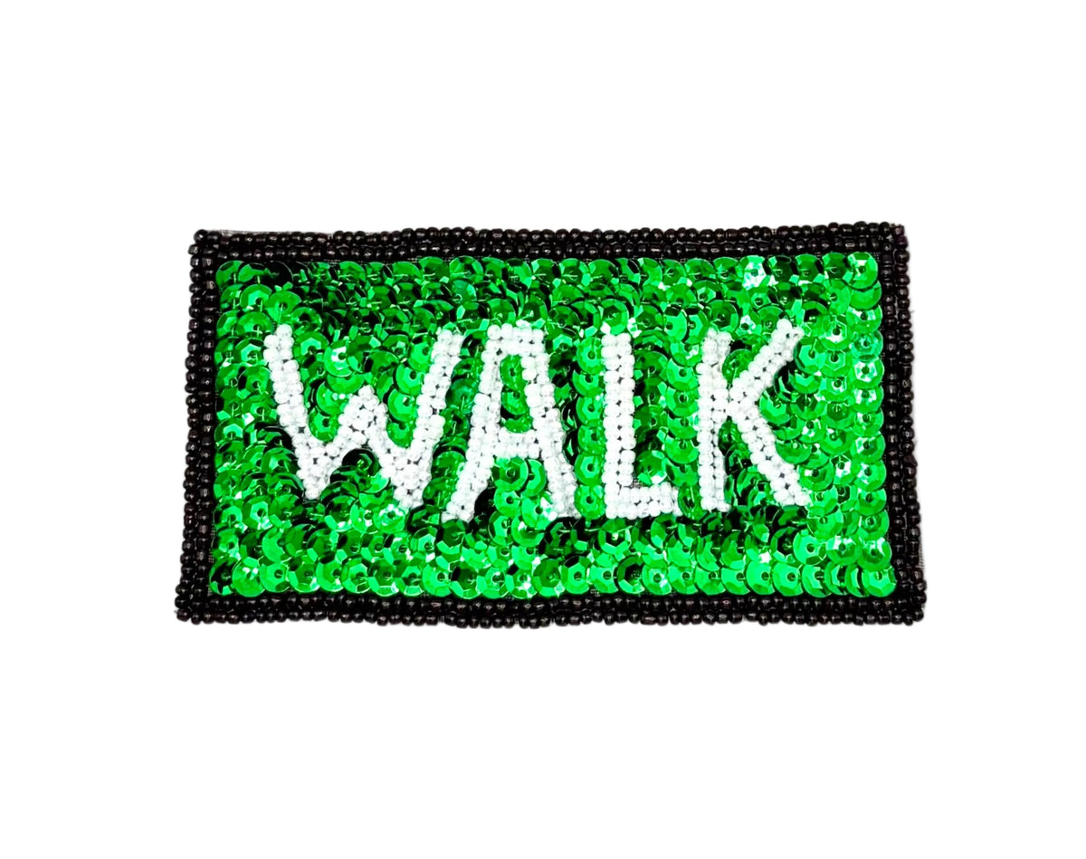 A rectangular patch covered in bright green sequins with the word 'WALK' in large white sequin letters and a black beaded border, shown on a plain white background.