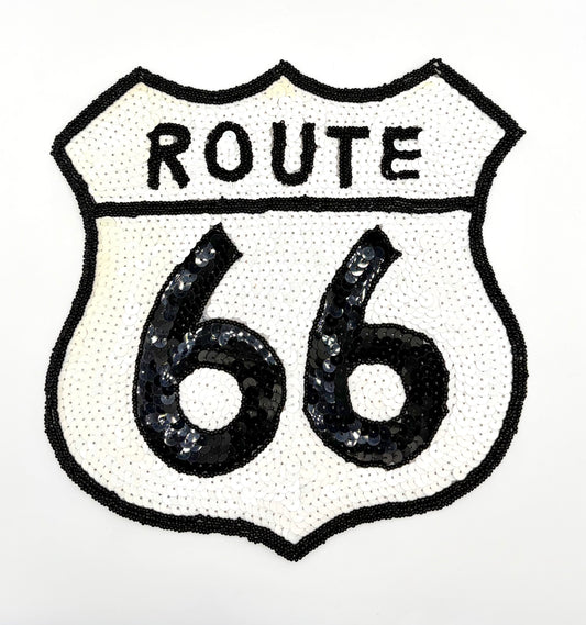A shield-shaped Route 66 patch featuring black sequins on a white background, with 'ROUTE' arched above large '66' numerals.